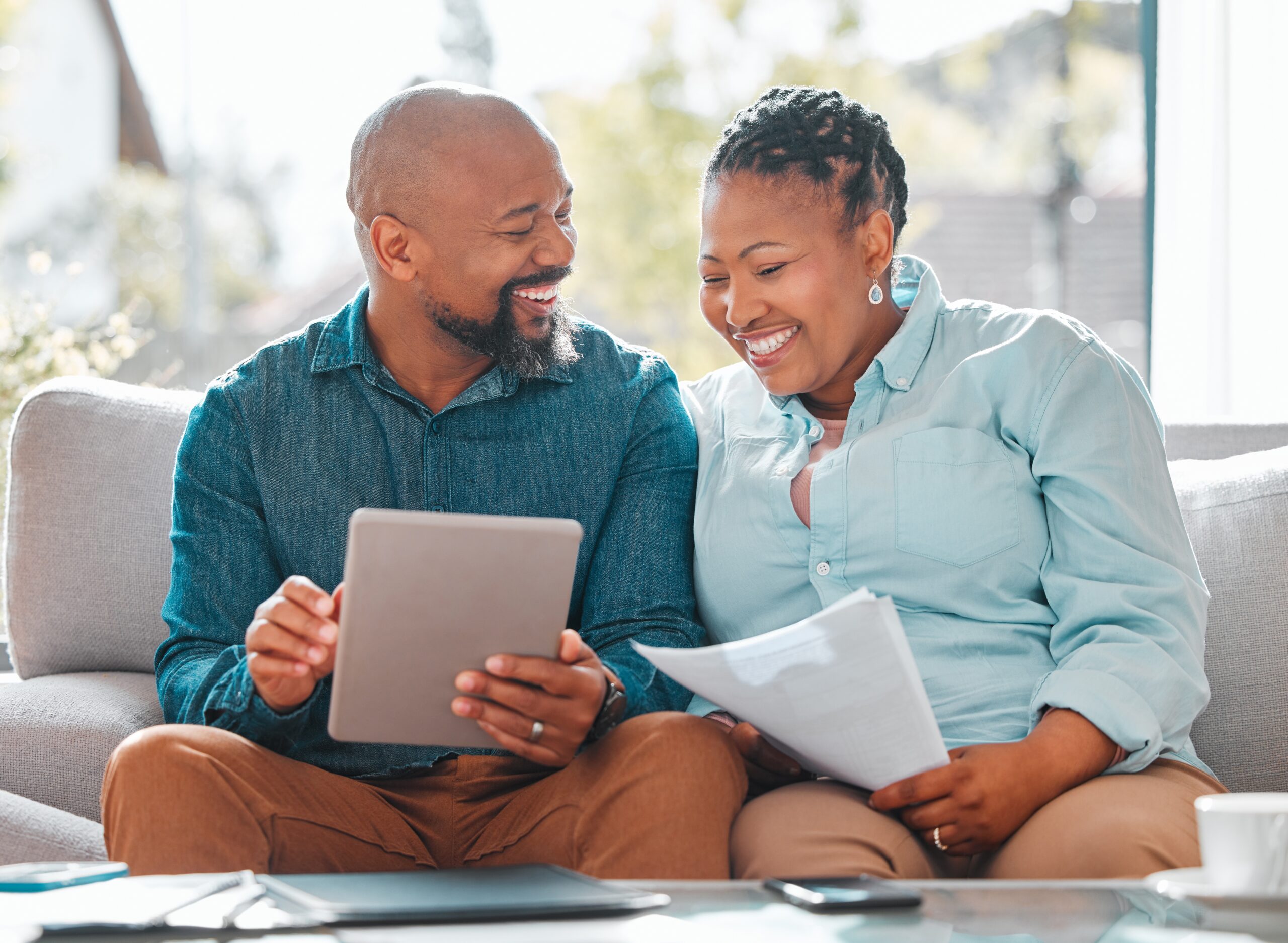 A,Mature,Couple, smiling and looking at documents