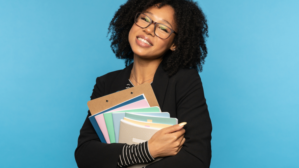 African American female student holding school supplies
